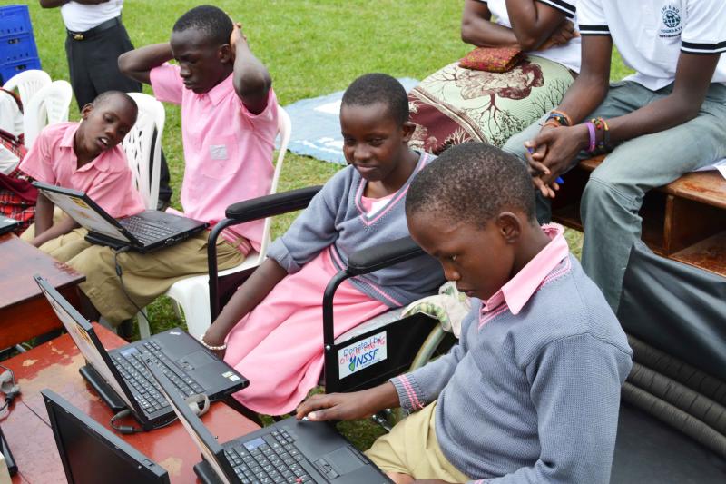 Students from schools of special needs being trained to use computers
