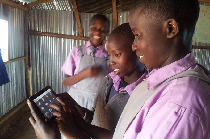 students_holding_tablet