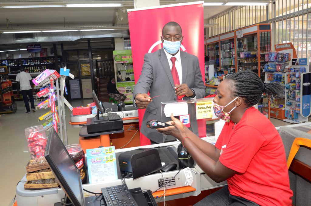 Michael Segwaya, Absa CFO demonstrates the use of the contactless feature on the Absa Vertical Debit Card