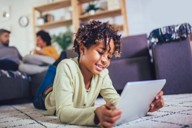 girl reading children's books on kindle