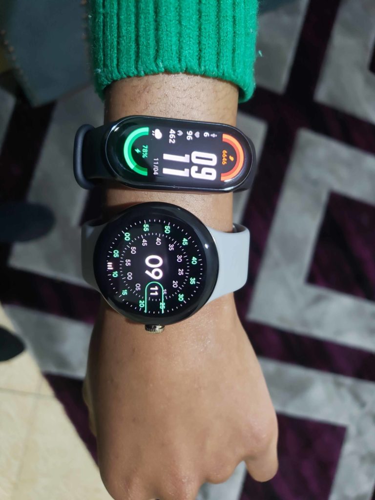 google pixel watch and xiaomi smart band 8 on wrist